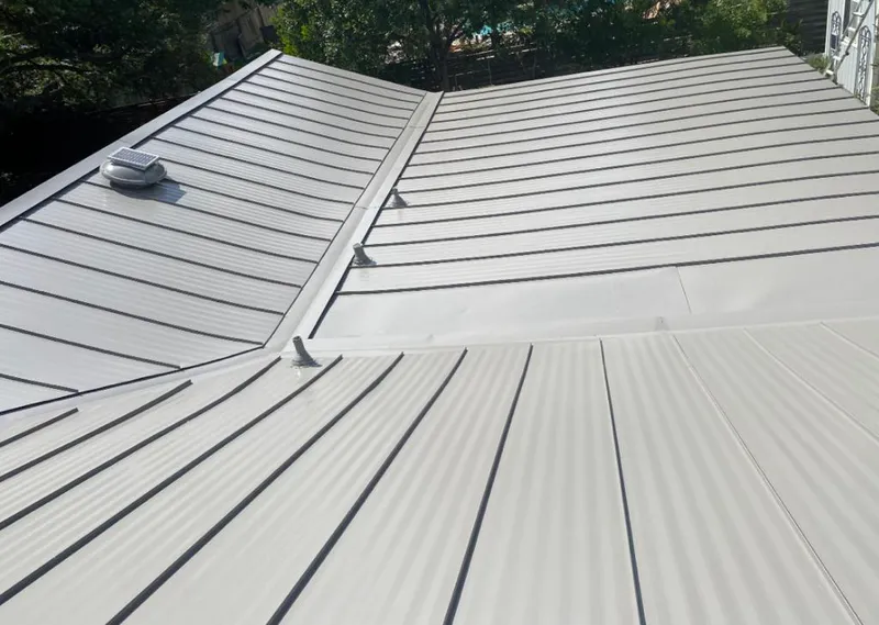 Solar attic fan installed on a metal roof for Roof Ventilation in Texarkana